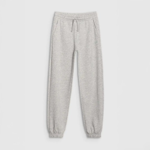 Szare Chłopięce spodnie dresowe joggery 4F – wygodne, oversize, idealne do szkoły i na trening.